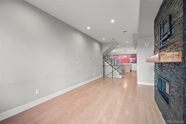a kitchen with kitchen island a sink stainless steel appliances and cabinets