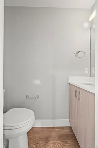 a kitchen with kitchen island granite countertop a stove a sink a center island a refrigerator and cabinets