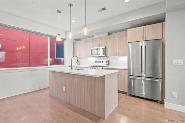 an entryway in a hall with a front door