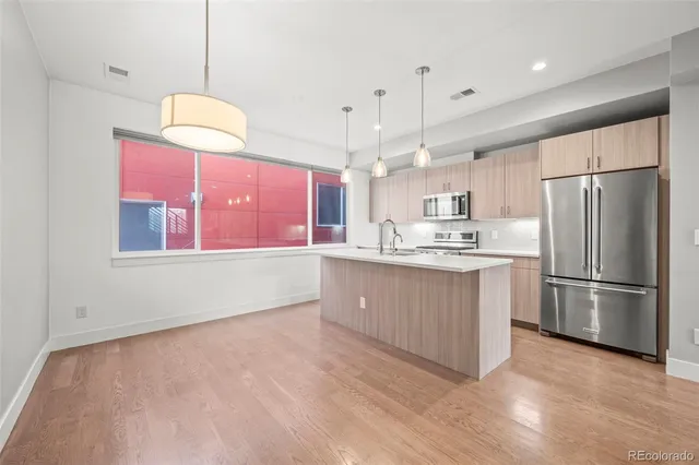 a bathroom with a double vanity sink mirror and shower