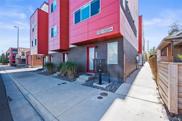 a view of a brick house with many windows