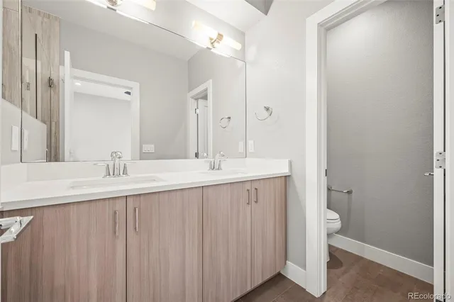 a bathroom with a bathtub a sink and a mirror