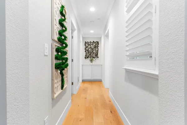 a spacious bedroom with a bed and a flat screen tv