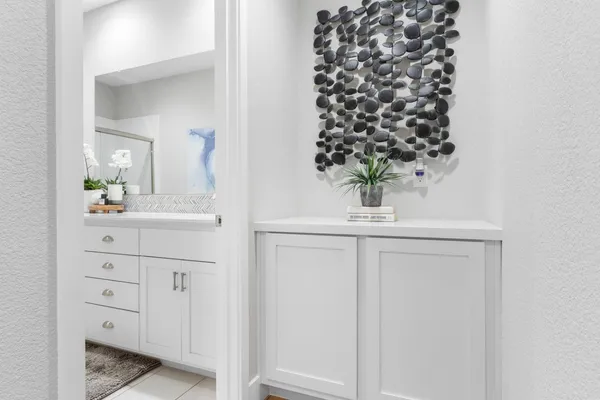 a bedroom with a flat screen tv and a bed