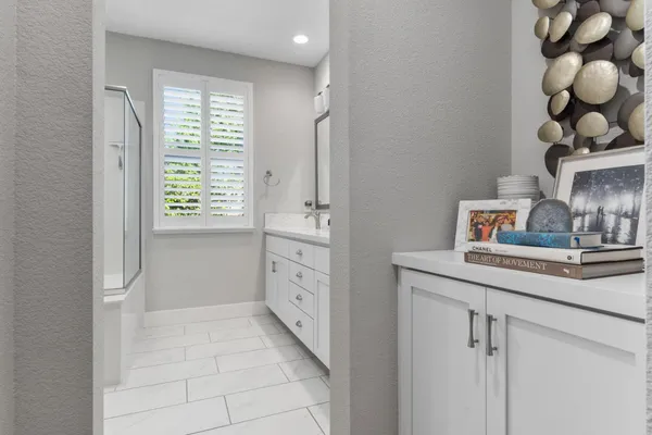 a bedroom with furniture and a window