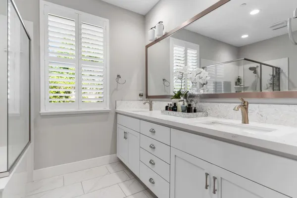 a view of a workspace with furniture and wooden floor