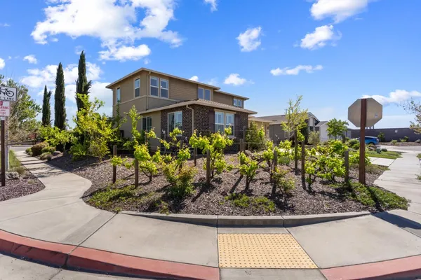 a front view of a house with garden