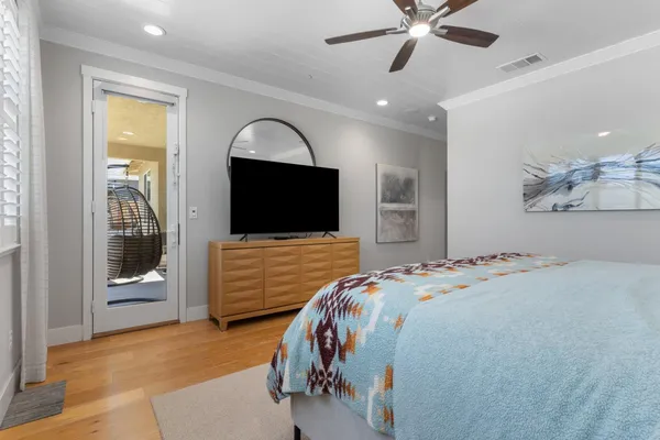 a view of a workspace with furniture and wooden floor