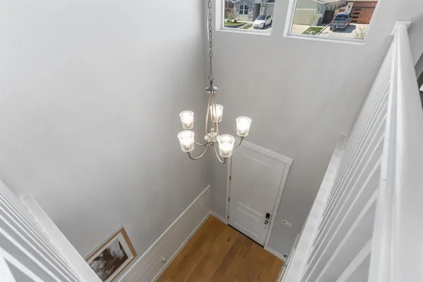 a view of a patio with a table and chairs under an umbrella