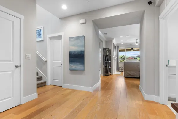a view of empty room with wooden floor and cabinet