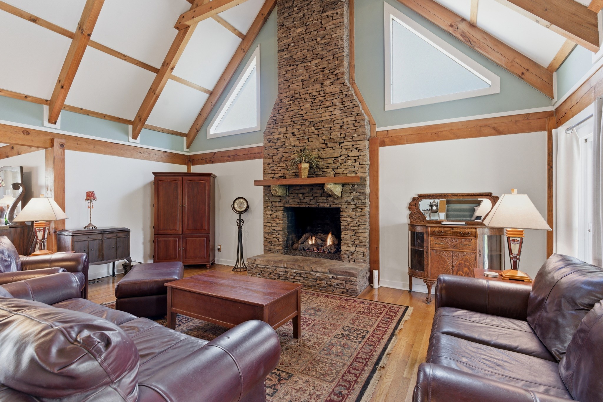 551 Mt Pleasant Road Kingston Springs, TN 37082 - Photo 13 of 68 a living room with furniture and a fireplace