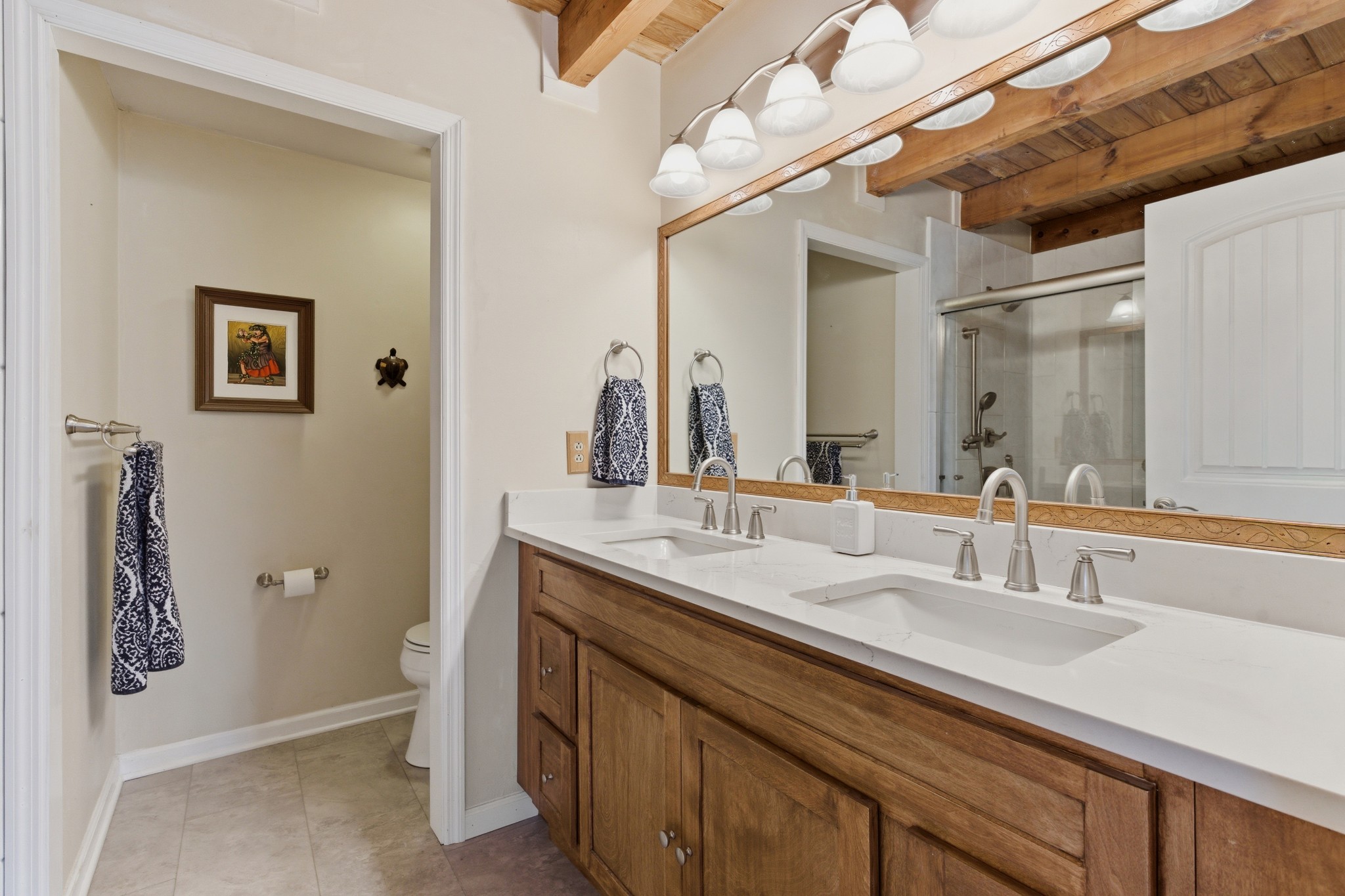 551 Mt Pleasant Road Kingston Springs, TN 37082 - Photo 32 of 68 a bathroom with a double vanity sink and a mirror