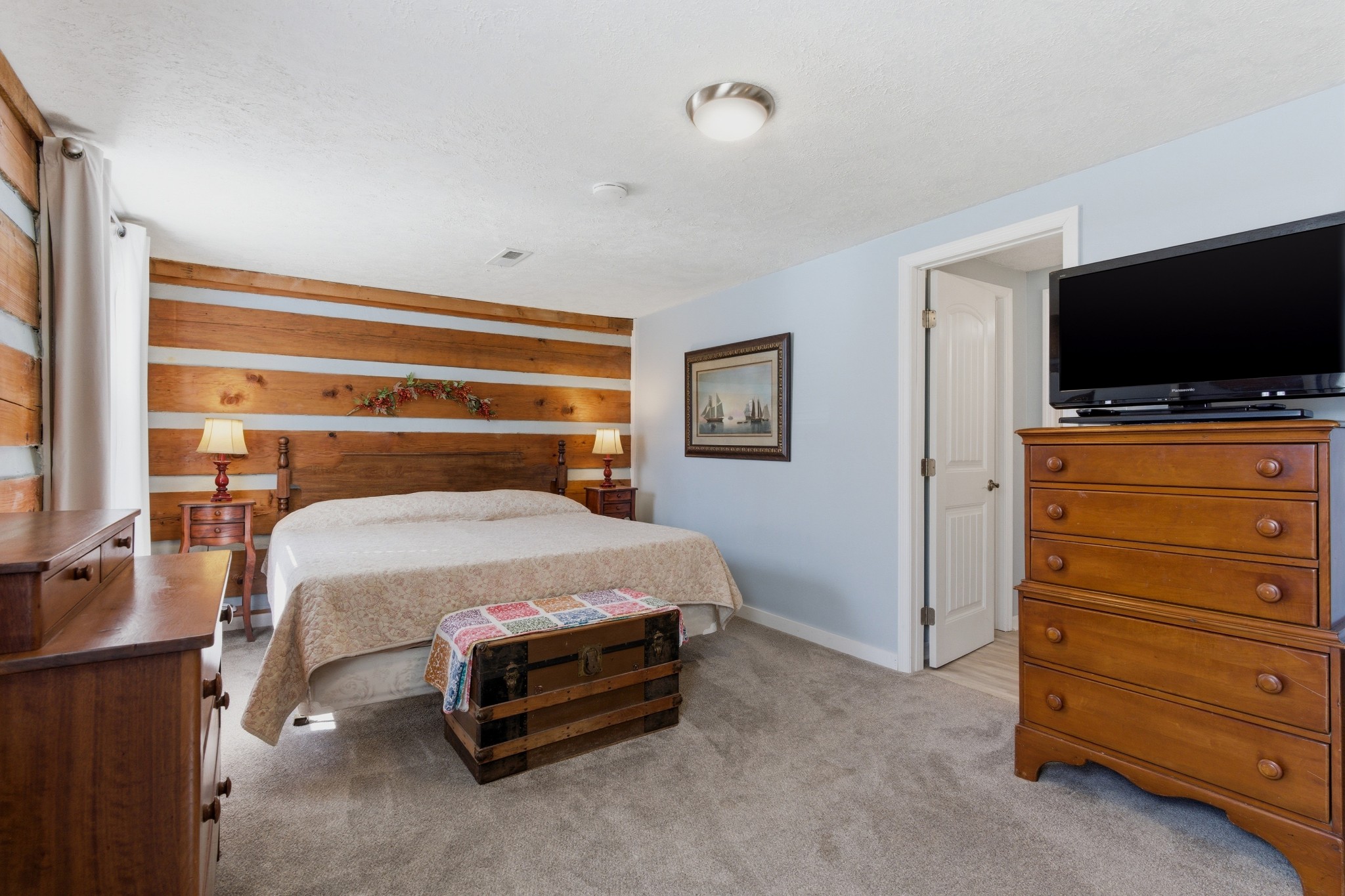 551 Mt Pleasant Road Kingston Springs, TN 37082 - Photo 36 of 68 a bedroom with a bed and a flat screen tv