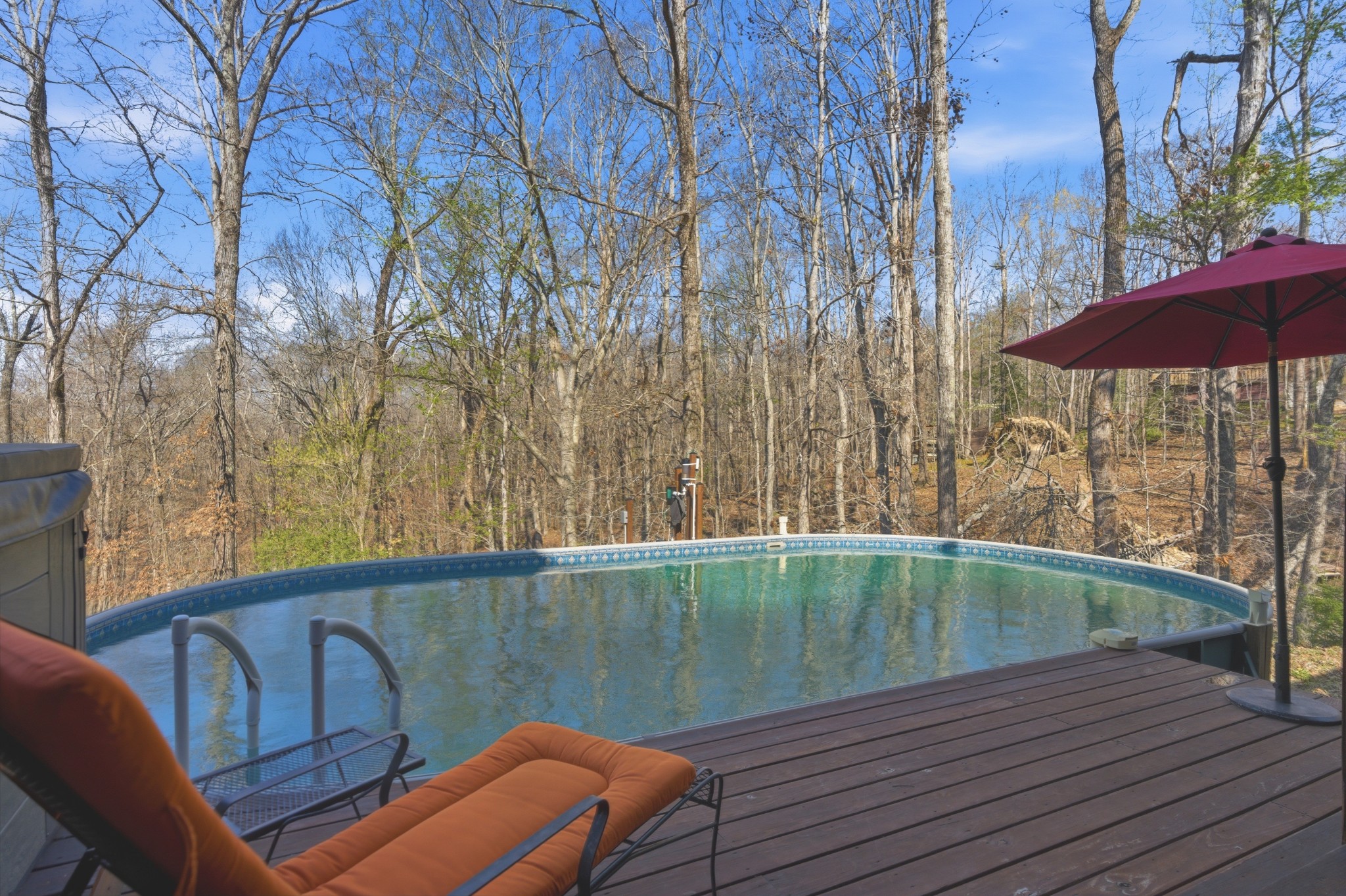 551 Mt Pleasant Road Kingston Springs, TN 37082 - Photo 46 of 68 a view of a swimming pool with a lounge chairs