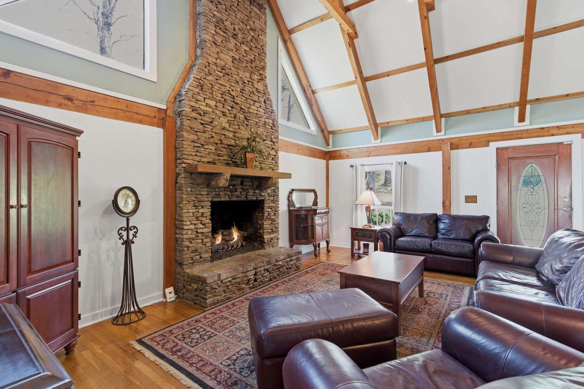 551 Mt Pleasant Road Kingston Springs, TN 37082 - Photo 7 of 68 a living room with furniture a fireplace and a flat screen tv