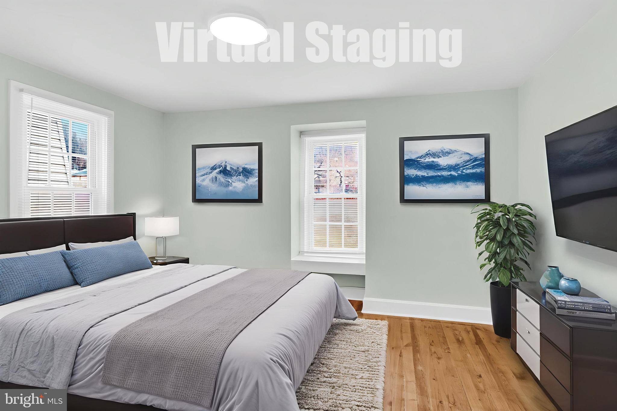 726 South 2nd Street Steelton, PA 17113 - Photo 12 of 25 a bedroom with a large bed and a couch