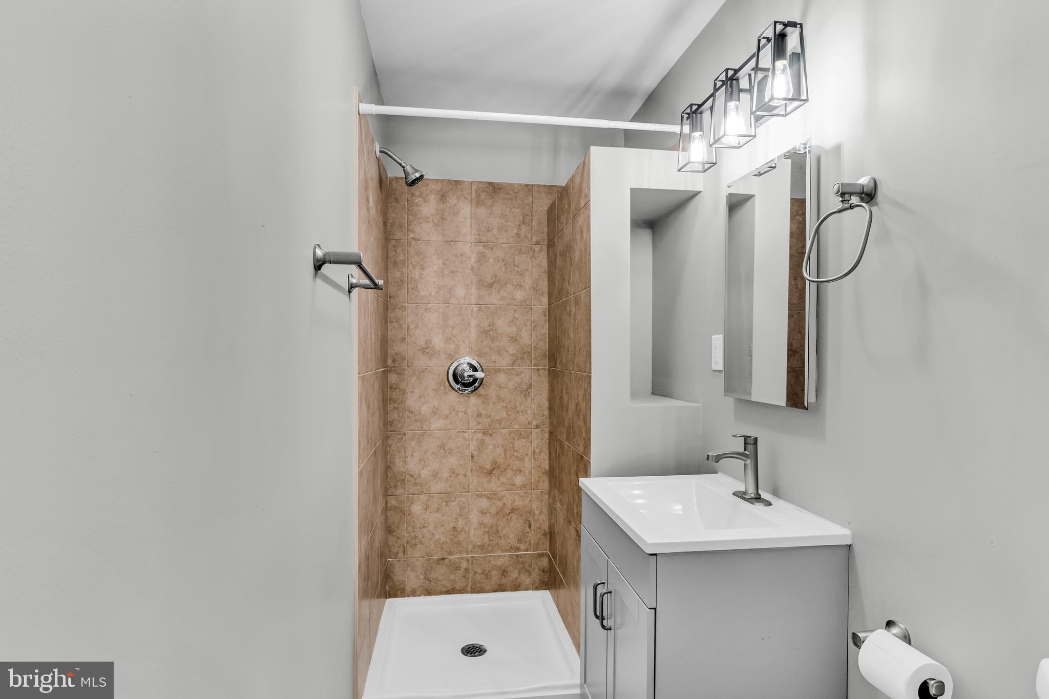 726 South 2nd Street Steelton, PA 17113 - Photo 10 of 25 a bathroom with a sink a toilet and shower