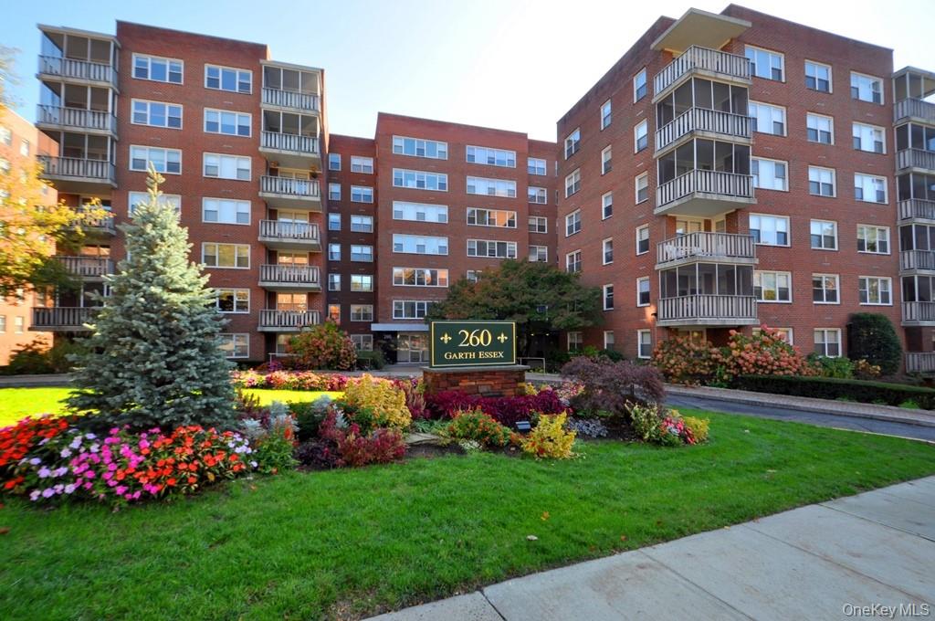260 Garth Road, Unit 4G5 Scarsdale, NY 10583 - Photo 2 of 48 a large building with a yard in front of it