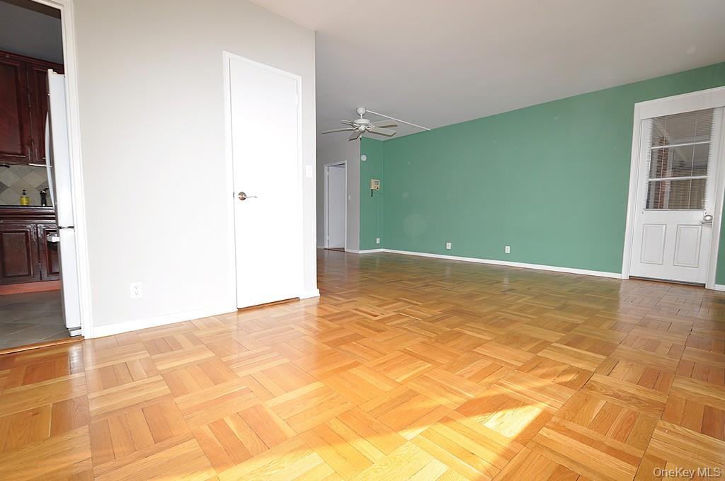 260 Garth Road, Unit 4G5 Scarsdale, NY 10583 - Photo 23 of 48 a view of a big room with wooden floor and windows