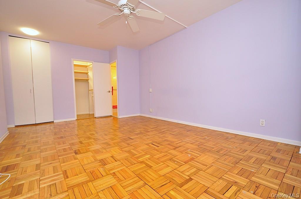 260 Garth Road, Unit 4G5 Scarsdale, NY 10583 - Photo 28 of 48 a view of empty room with wooden floor