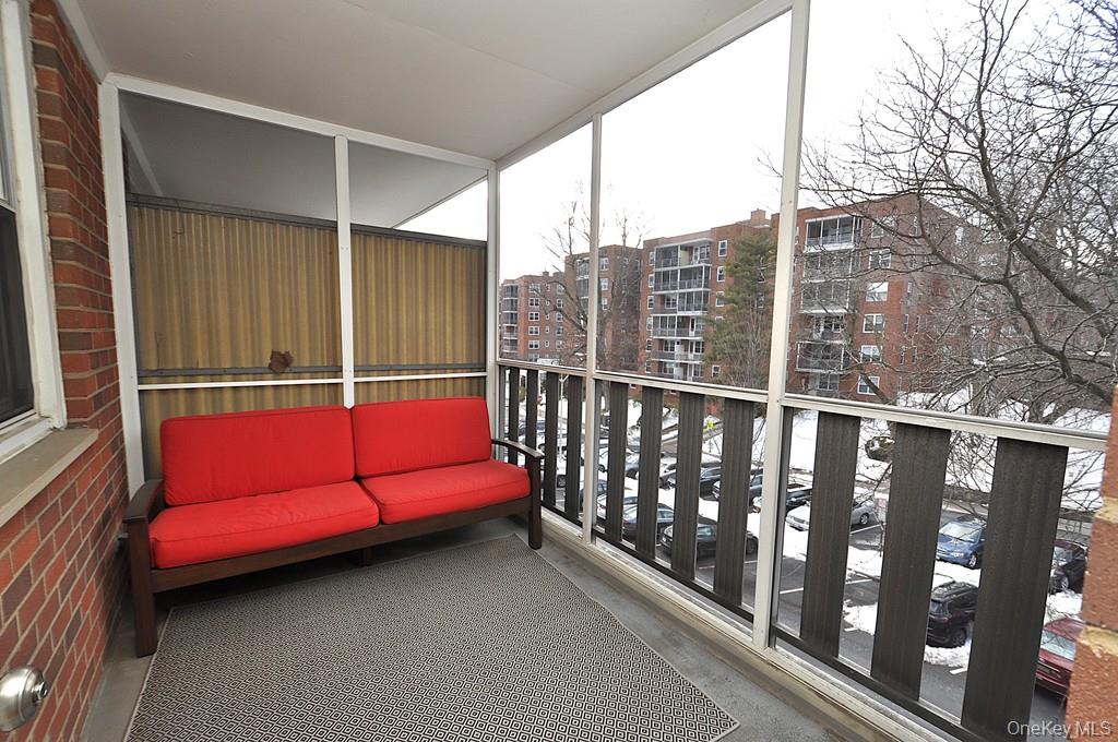 260 Garth Road, Unit 4G5 Scarsdale, NY 10583 - Photo 6 of 48 a view of a balcony with couch