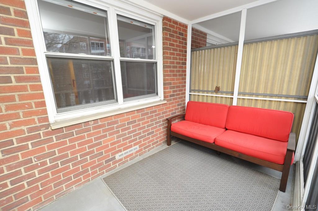 260 Garth Road, Unit 4G5 Scarsdale, NY 10583 - Photo 8 of 48 a blue bench sitting in front of a window