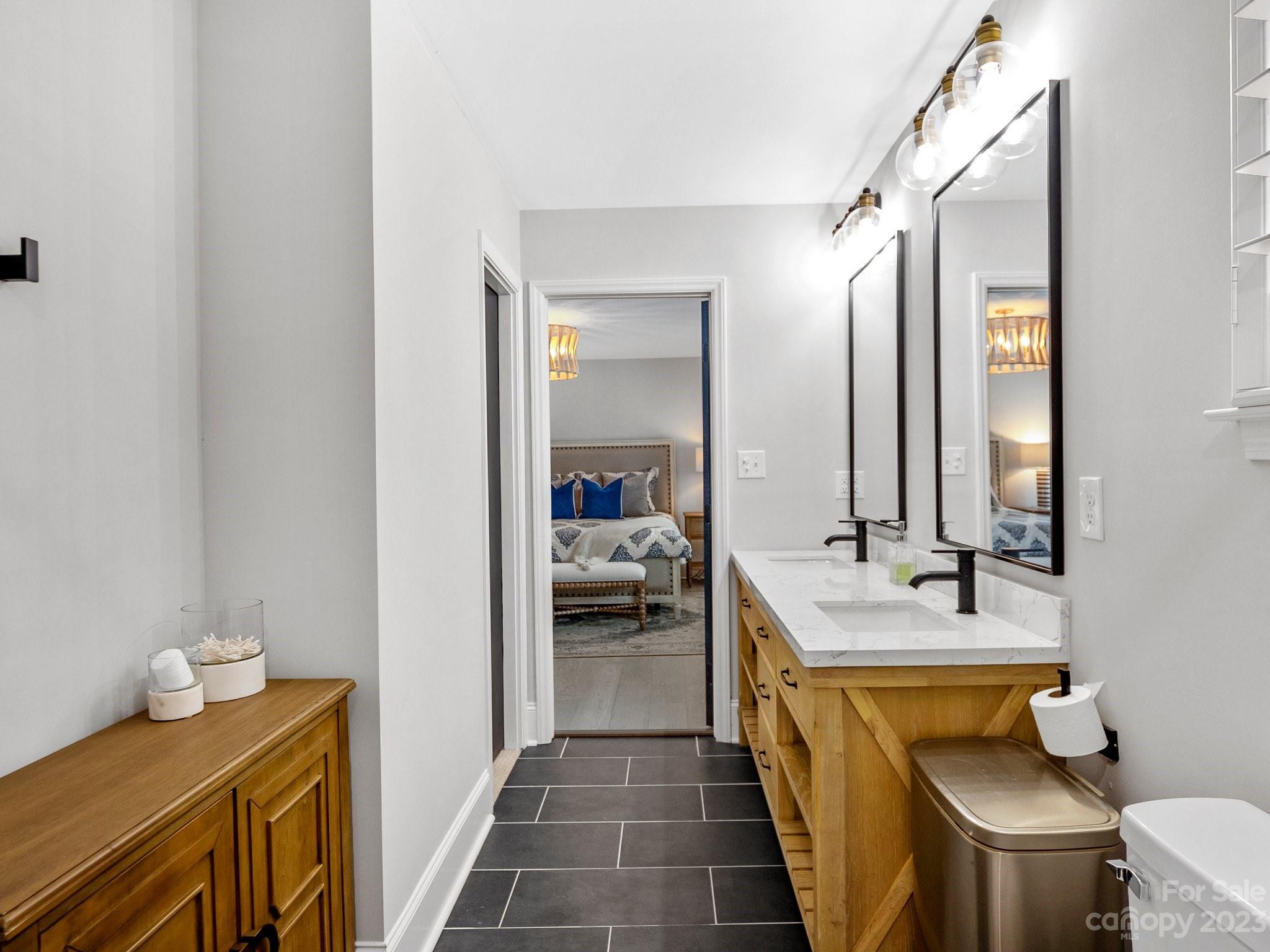 4516 Rounding Run Road Charlotte, NC 28277 - Photo 18 of 33 a en suite bathroom with a double vanity sink and a mirror