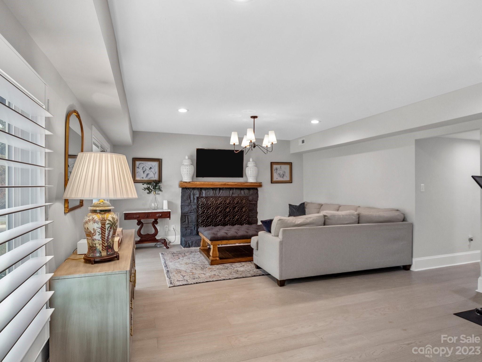 4516 Rounding Run Road Charlotte, NC 28277 - Photo 20 of 33 a living room with furniture and a fireplace