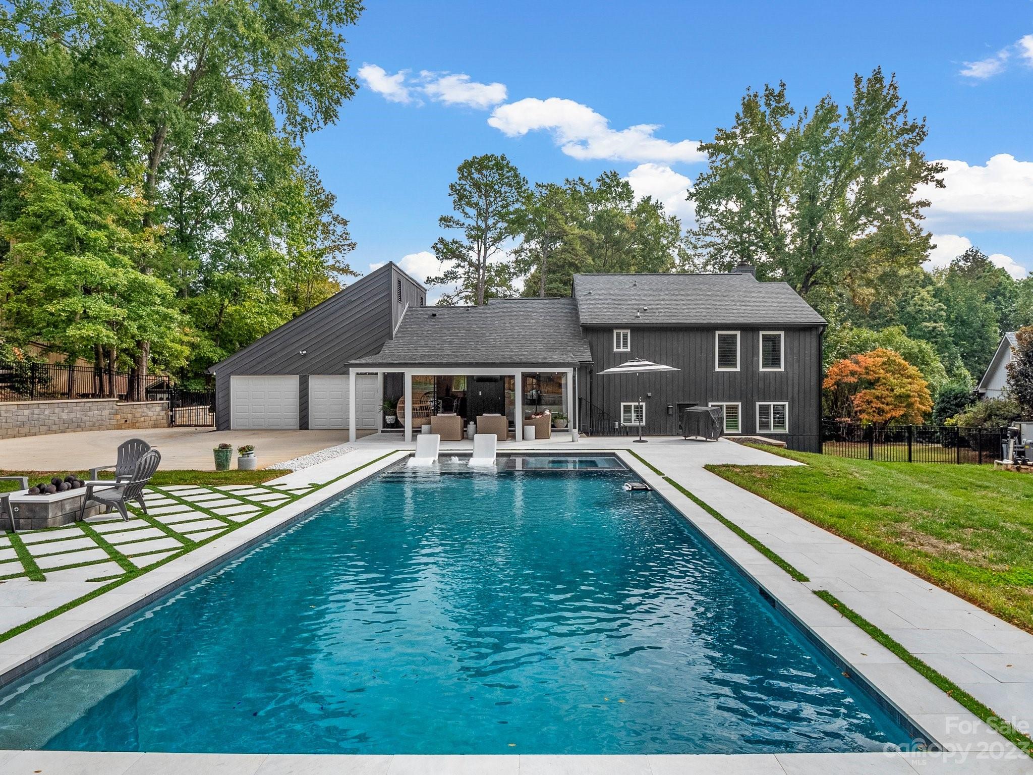 4516 Rounding Run Road Charlotte, NC 28277 - Photo 26 of 33 a house with swimming pool in front of it