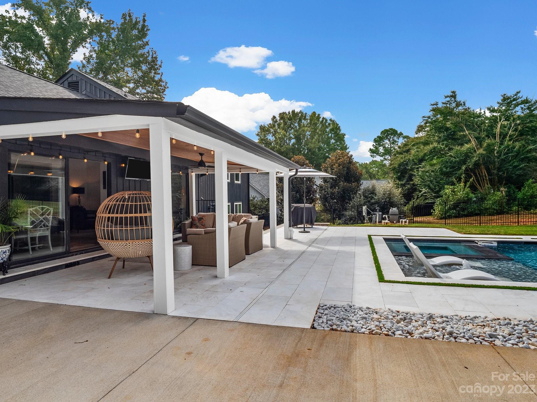 4516 Rounding Run Road Charlotte, NC 28277 - Photo 29 of 33 a view of a house with swimming pool and sitting area