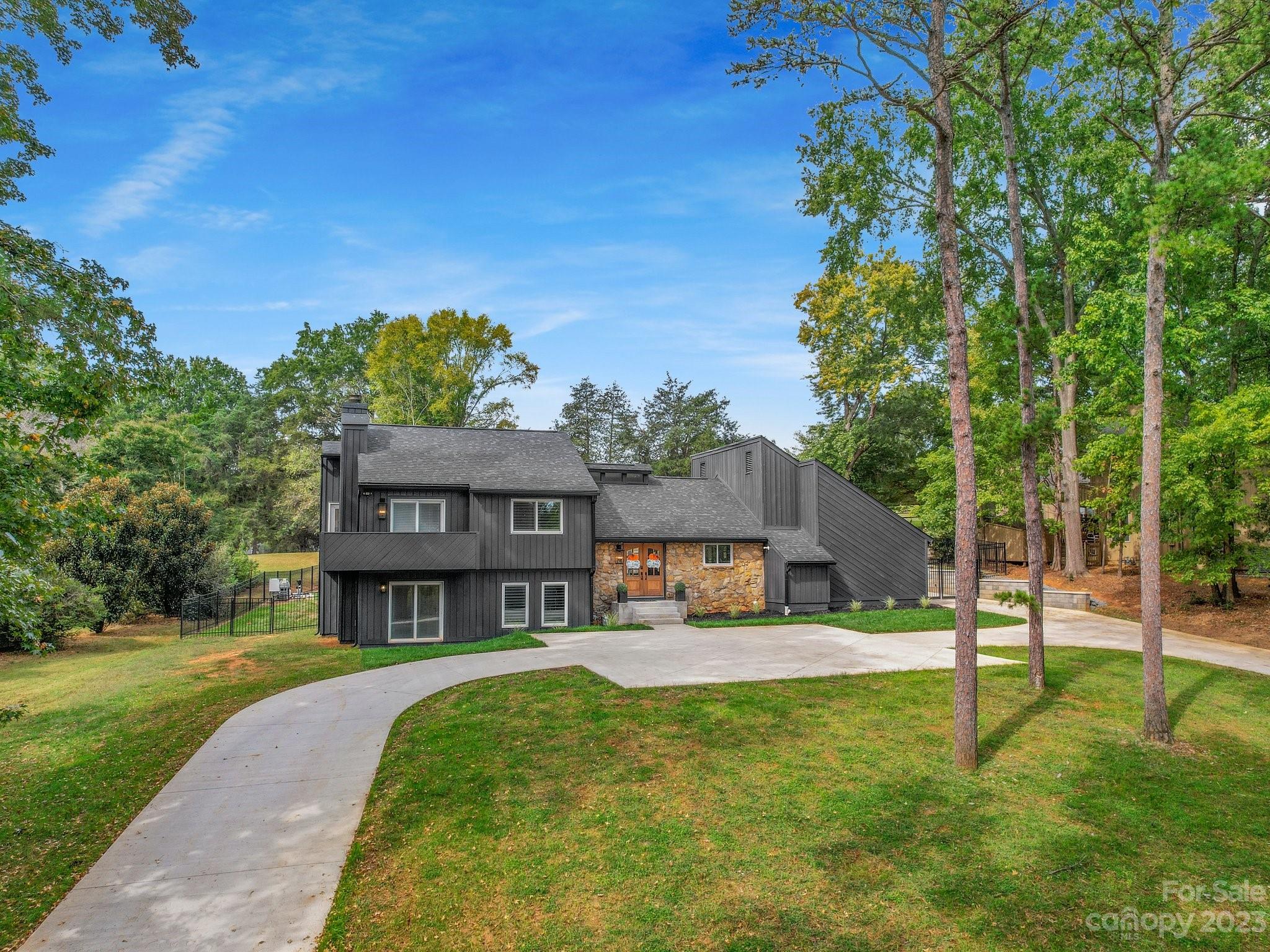 4516 Rounding Run Road Charlotte, NC 28277 - Photo 3 of 33 a front view of a house with a yard
