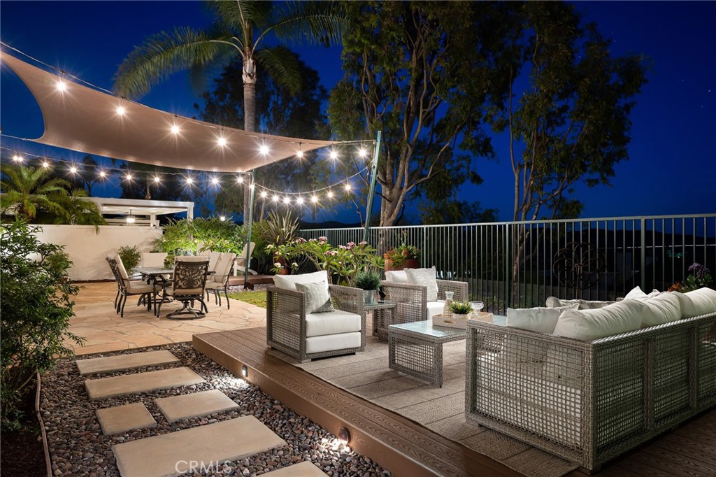 12 Serna Rancho Santa Margarita, CA 92688 - Photo 1 of 75 a outdoor living space with patio furniture and potted plants