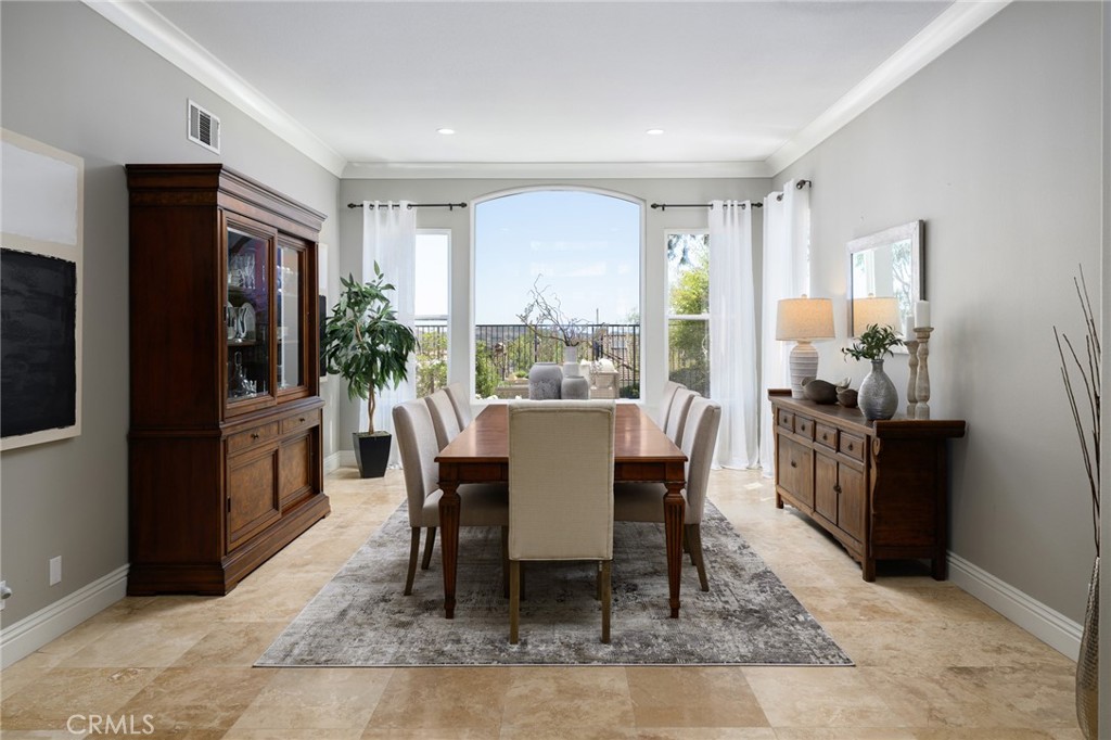 12 Serna Rancho Santa Margarita, CA 92688 - Photo 10 of 75 The main level also includes a formal dining room with large windows, which could be used as a living room.