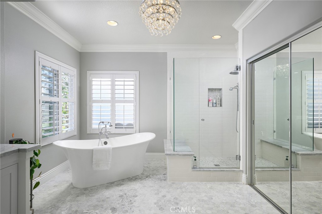 12 Serna Rancho Santa Margarita, CA 92688 - Photo 19 of 75 a spacious bathroom with a tub shower and windows