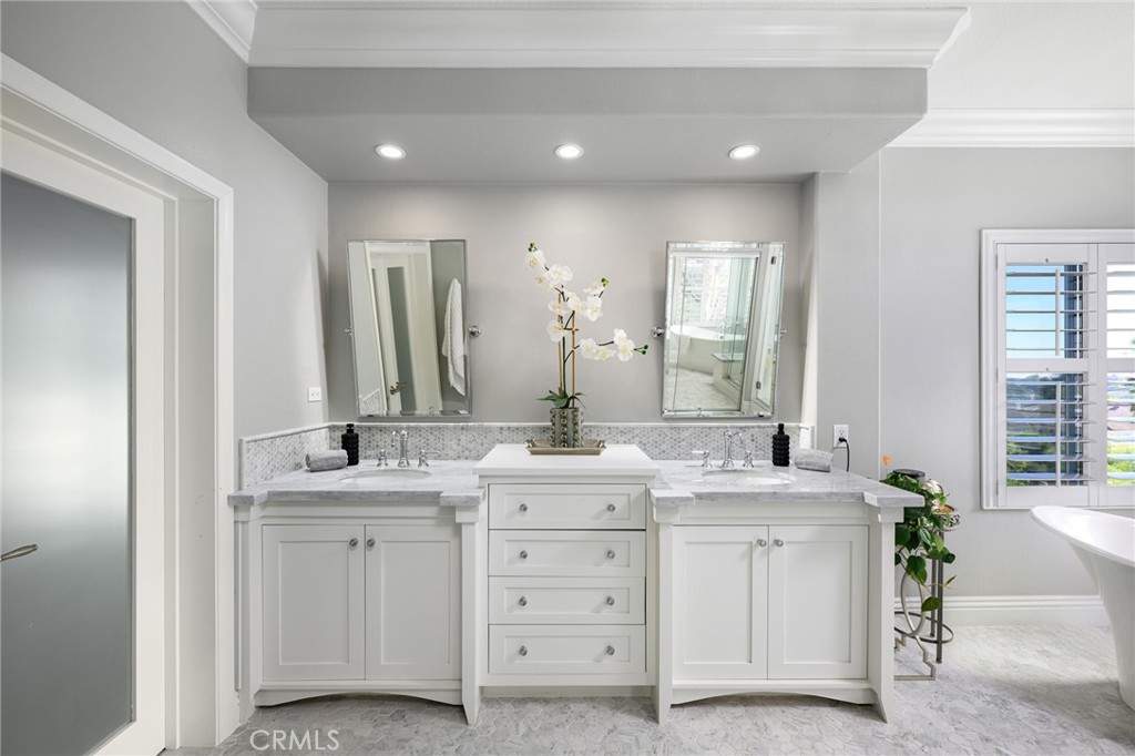 12 Serna Rancho Santa Margarita, CA 92688 - Photo 20 of 75 a bathroom with a double vanity sink and a mirror