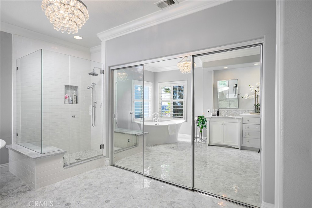 12 Serna Rancho Santa Margarita, CA 92688 - Photo 21 of 75 The primary bathroom has dual closets with elegant glass doors.