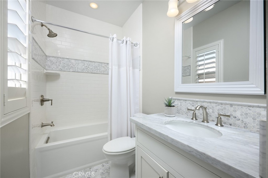 12 Serna Rancho Santa Margarita, CA 92688 - Photo 26 of 75 a bathroom with a granite countertop sink toilet and shower