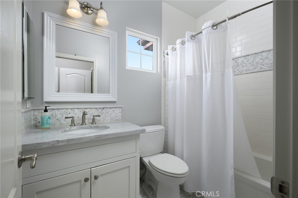 12 Serna Rancho Santa Margarita, CA 92688 - Photo 28 of 75 a bathroom with a granite countertop sink toilet and shower