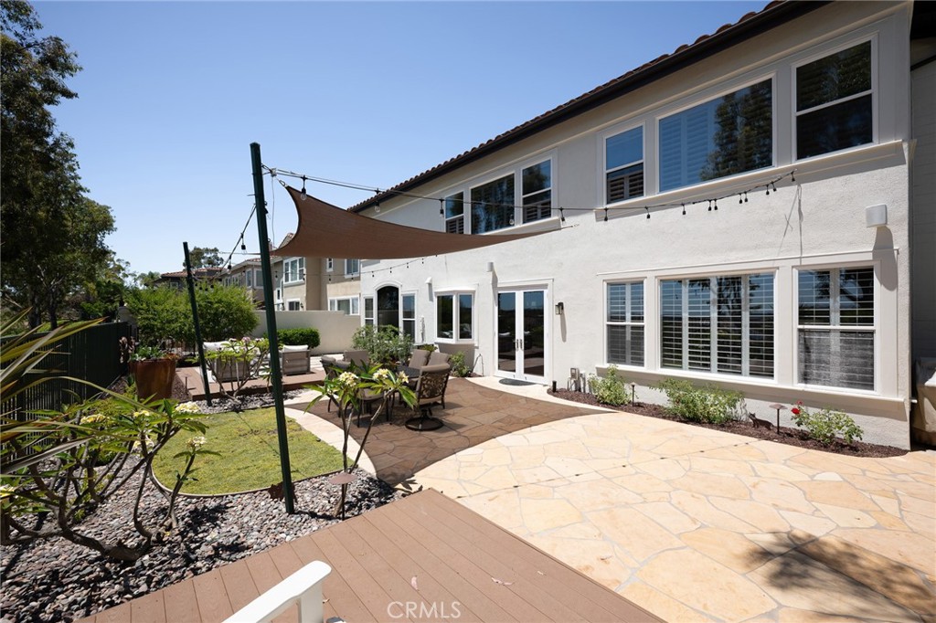 12 Serna Rancho Santa Margarita, CA 92688 - Photo 39 of 75 a view of a house with backyard sitting area and garden
