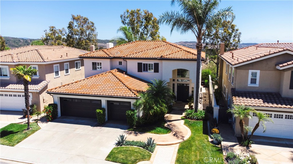 12 Serna Rancho Santa Margarita, CA 92688 - Photo 50 of 75 a front view of a house with a garden
