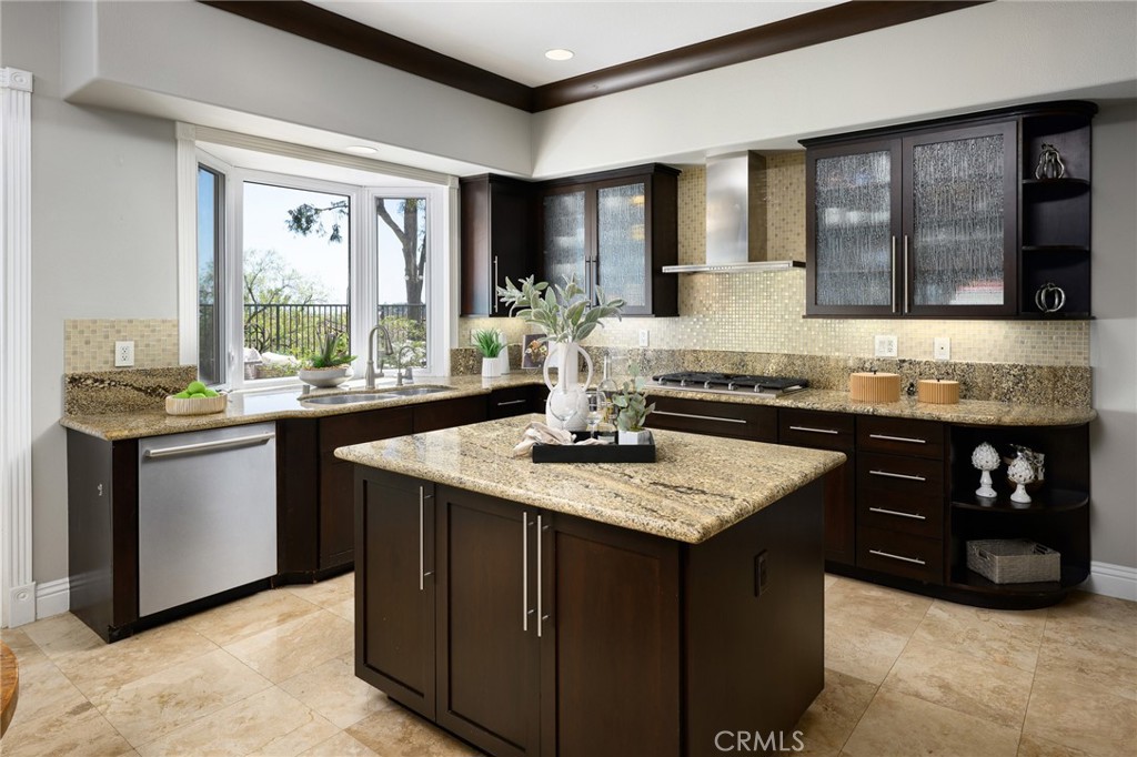 12 Serna Rancho Santa Margarita, CA 92688 - Photo 6 of 75 a kitchen with stainless steel appliances granite countertop a sink and a stove
