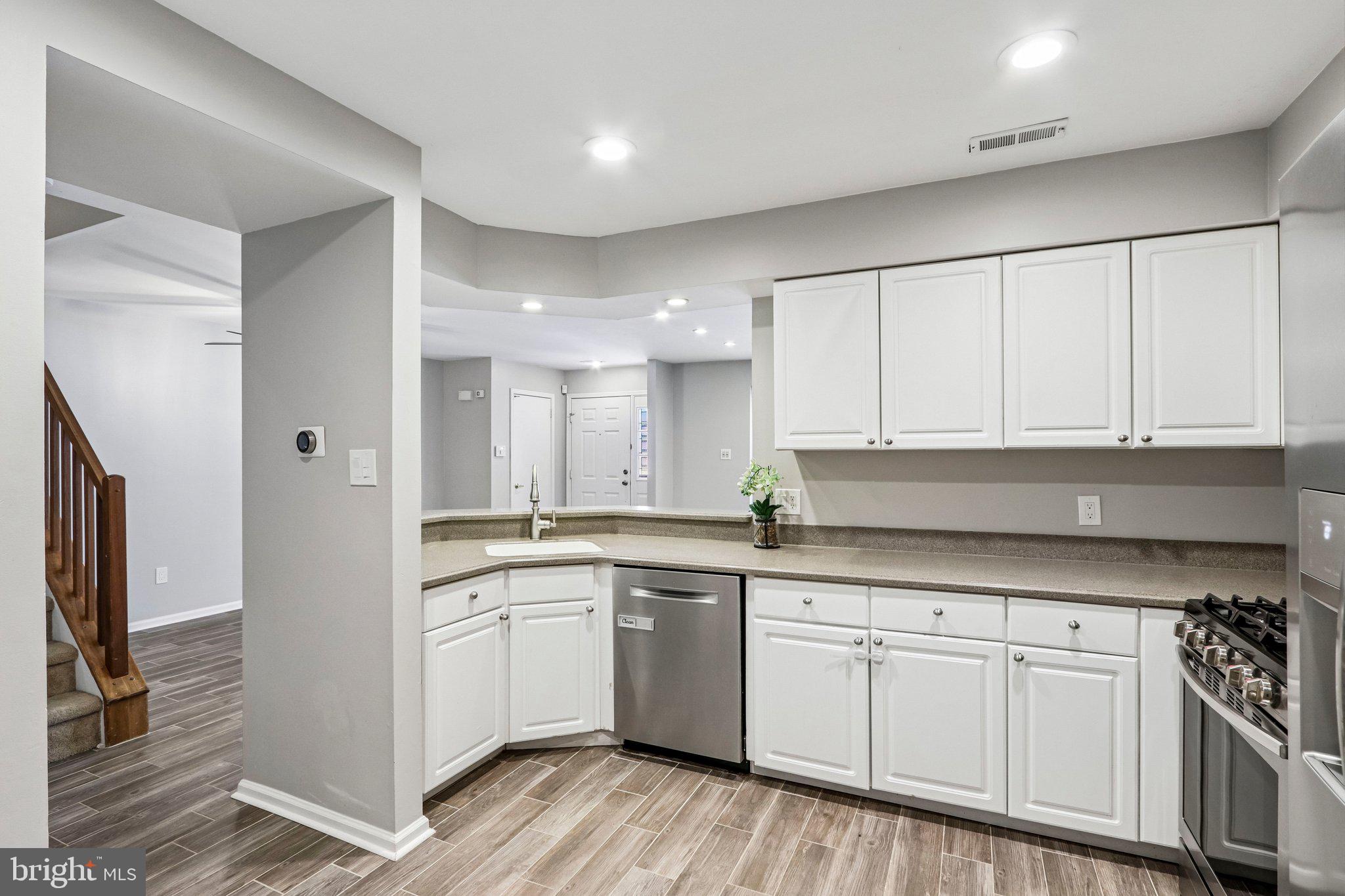 803 Wharton Road Mount Laurel, NJ 08054 - Photo 6 of 48 a kitchen with white cabinets stainless steel appliances and sink