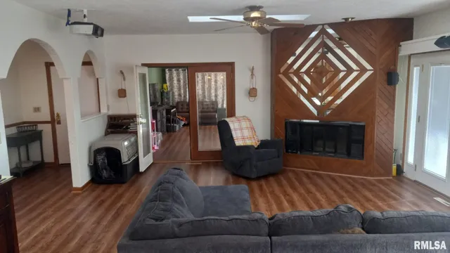 a living room with furniture and a fireplace