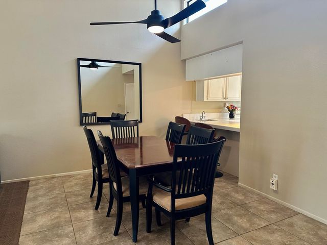 a view of a dining room and livingroom with furniture and wooden floor