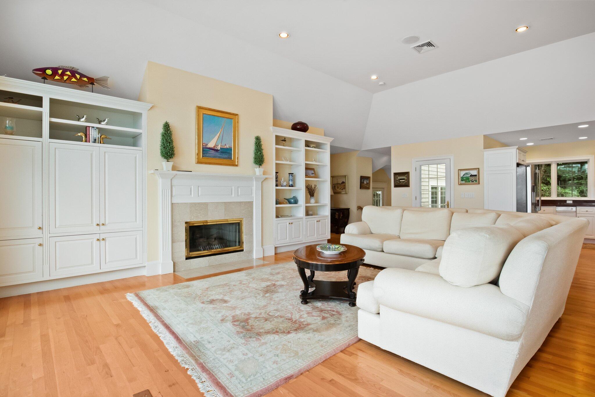 99 Center Lane Centerville, MA 02632 - Photo 15 of 89 a living room with furniture and a fireplace