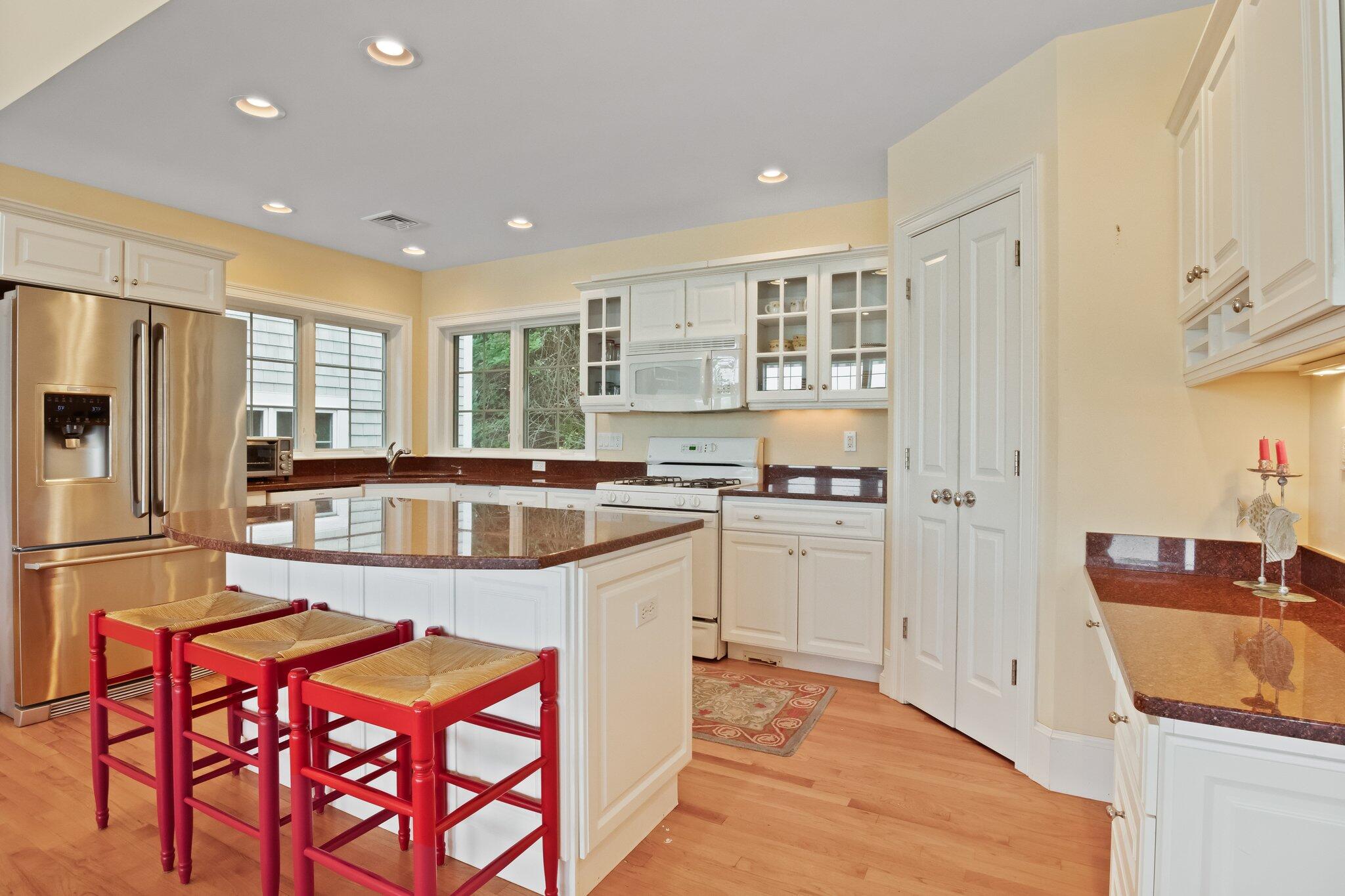99 Center Lane Centerville, MA 02632 - Photo 20 of 89 a kitchen with stainless steel appliances granite countertop a refrigerator and a stove top oven