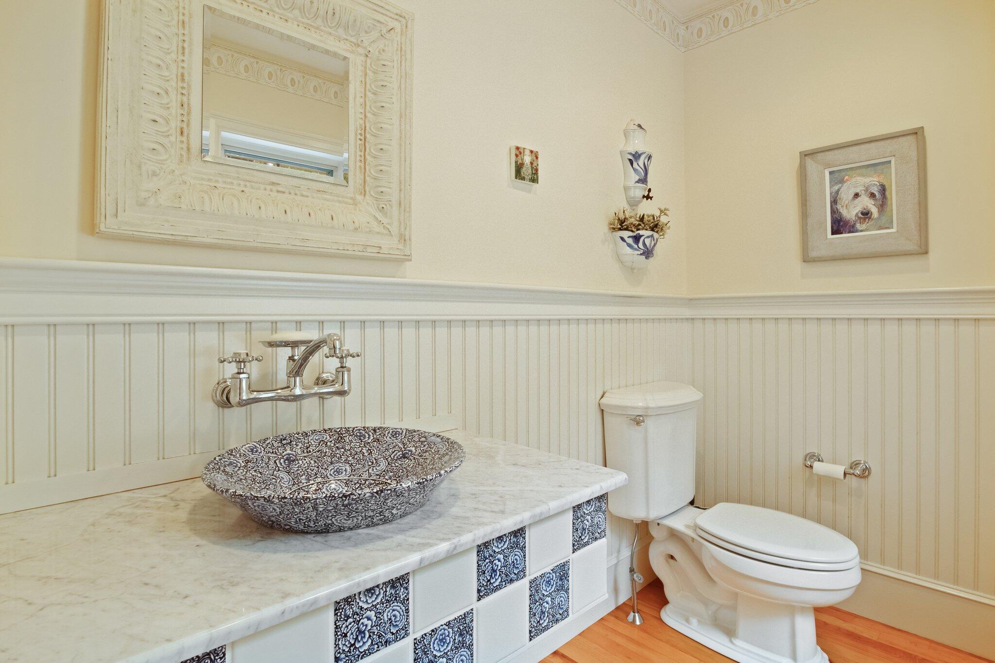 99 Center Lane Centerville, MA 02632 - Photo 26 of 89 a bathroom with a granite countertop sink a toilet and a mirror