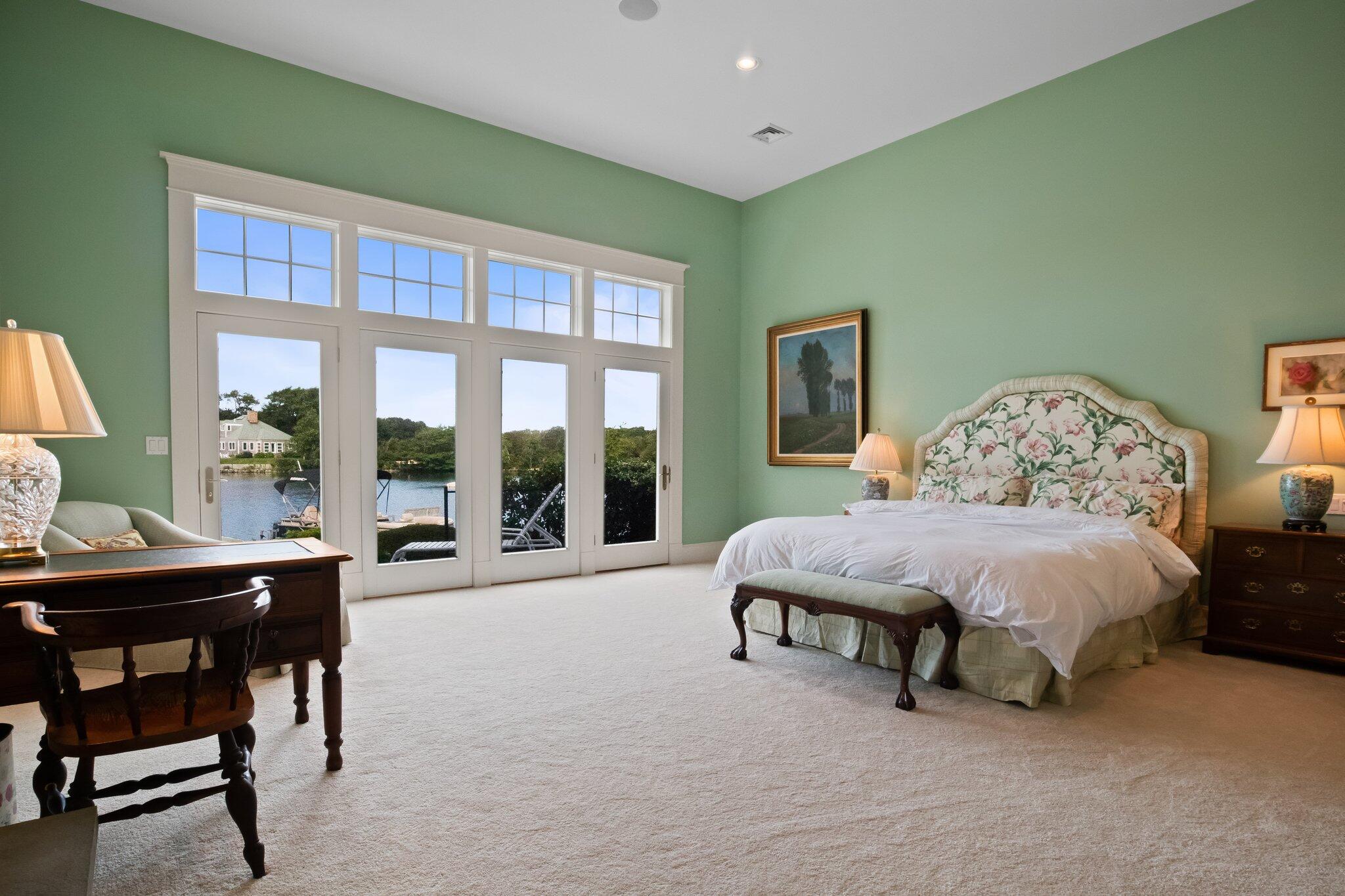 99 Center Lane Centerville, MA 02632 - Photo 28 of 89 a spacious bedroom with a bed and a large window