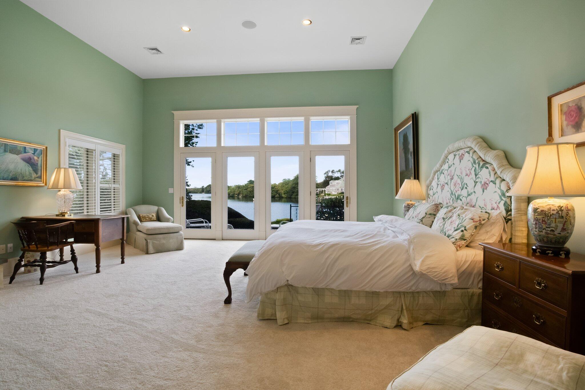 99 Center Lane Centerville, MA 02632 - Photo 30 of 89 a bedroom with a bed and large windows