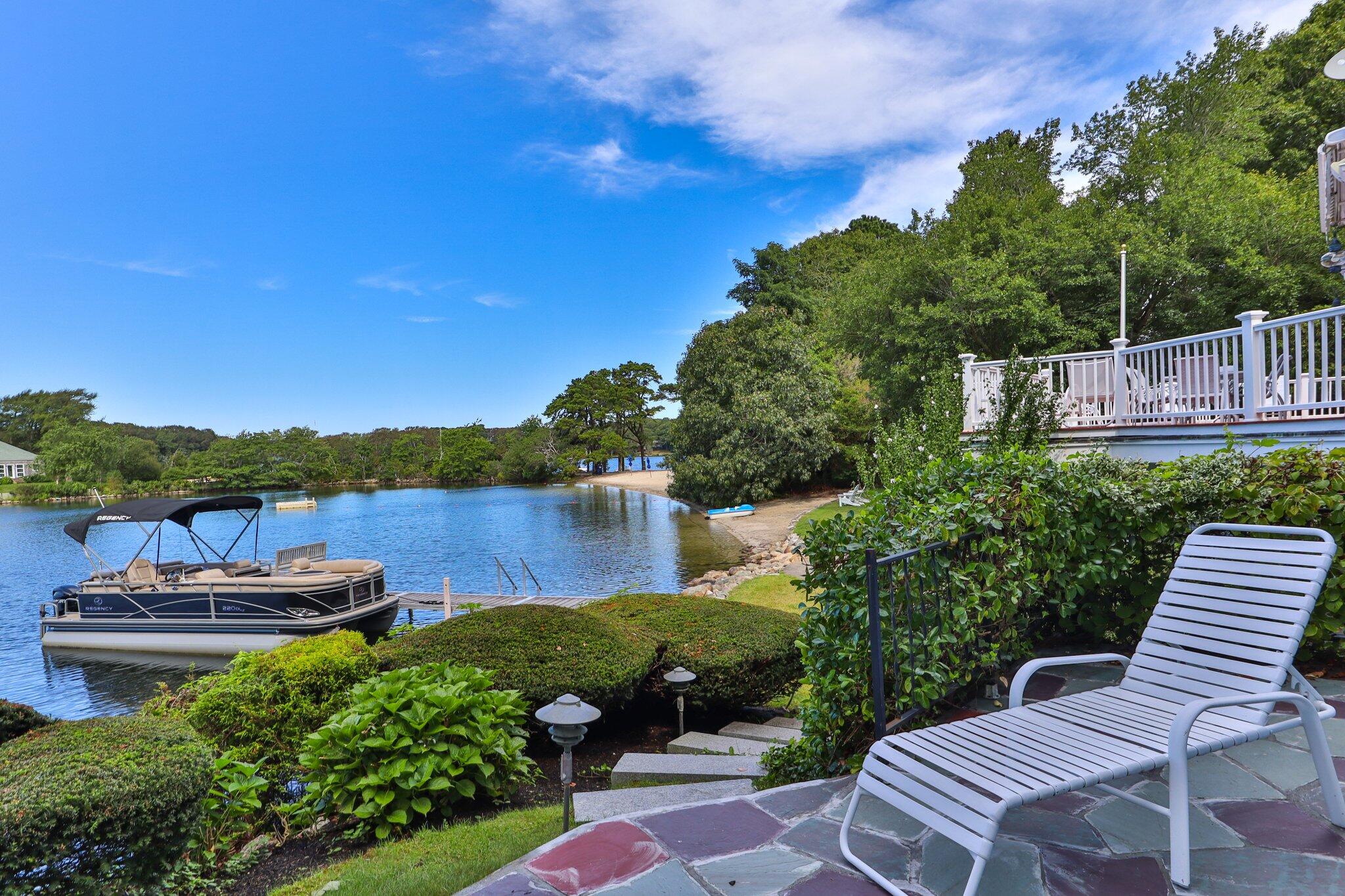 99 Center Lane Centerville, MA 02632 - Photo 39 of 89 a view of a lake with furniture and city view